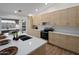 Updated kitchen with light wood cabinets and white quartz countertops at 3077 W Ironwood Cir, Chandler, AZ 85226