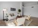 Relaxing living room with hardwood floors and light and airy decor at 3077 W Ironwood Cir, Chandler, AZ 85226