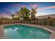 Refreshing pool surrounded by a well-maintained yard at 3077 W Ironwood Cir, Chandler, AZ 85226