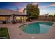 Stunning pool and patio area at sunset at 3077 W Ironwood Cir, Chandler, AZ 85226