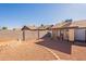 Backyard with gravel, block wall, and screened patio at 3344 E Crescent Ave, Mesa, AZ 85204