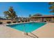 Community pool with surrounding fence and patio at 3344 E Crescent Ave, Mesa, AZ 85204