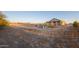 Expansive backyard, mostly gravel with some small plants at 34214 W Sahuaro St, Tonopah, AZ 85354