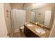 Bathroom boasts dual sinks, granite countertops, and a shower/tub combination at 34214 W Sahuaro St, Tonopah, AZ 85354