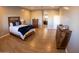 Main bedroom with hardwood floors and en-suite bathroom access at 34214 W Sahuaro St, Tonopah, AZ 85354