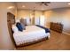 Main bedroom with hardwood floors and en-suite bathroom access at 34214 W Sahuaro St, Tonopah, AZ 85354