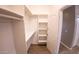 Spacious closet with shelving and hanging rods for storage at 34214 W Sahuaro St, Tonopah, AZ 85354