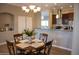 Dining area with four-chair table and chandelier at 34214 W Sahuaro St, Tonopah, AZ 85354