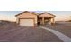 One-story house with attached garage and covered porch at 34214 W Sahuaro St, Tonopah, AZ 85354