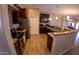 Kitchen with granite counters and dark wood cabinets at 34214 W Sahuaro St, Tonopah, AZ 85354