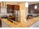 Kitchen with granite countertops and stainless steel appliances at 34214 W Sahuaro St, Tonopah, AZ 85354