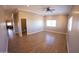 Spacious living room with tile floors and access to hallway at 34214 W Sahuaro St, Tonopah, AZ 85354