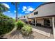 Spacious backyard patio with stone pavers and lush landscaping at 3448 W Sunshine Butte Dr, San Tan Valley, AZ 85144