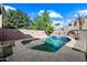 Relaxing backyard oasis with sparkling pool and patio at 3448 W Sunshine Butte Dr, San Tan Valley, AZ 85144