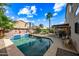 Inviting backyard pool with patio and covered seating area at 3448 W Sunshine Butte Dr, San Tan Valley, AZ 85144