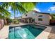 Refreshing backyard pool surrounded by a well-maintained yard at 3448 W Sunshine Butte Dr, San Tan Valley, AZ 85144