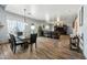 Open concept dining area with a glass table and leather chairs at 3448 W Sunshine Butte Dr, San Tan Valley, AZ 85144