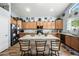 Well-equipped kitchen with light wood cabinets and granite countertops at 3448 W Sunshine Butte Dr, San Tan Valley, AZ 85144