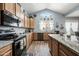 Modern kitchen with stainless steel appliances and granite countertops at 3448 W Sunshine Butte Dr, San Tan Valley, AZ 85144