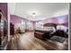 Large main bedroom with wood furniture and plush carpet at 3448 W Sunshine Butte Dr, San Tan Valley, AZ 85144