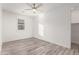 Spacious bedroom with ceiling fan and a closet at 35350 W Marin Ave, Maricopa, AZ 85138