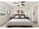 Spacious bedroom with king-size bed and ensuite bathroom access at 35350 W Marin Ave, Maricopa, AZ 85138