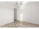 Bright bedroom with ceiling fan and window with plantation shutters at 35350 W Marin Ave, Maricopa, AZ 85138