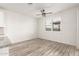 Bright dining area with wood-look floors and window shutters at 35350 W Marin Ave, Maricopa, AZ 85138