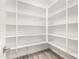 Bright walk-in pantry with ample shelving at 35350 W Marin Ave, Maricopa, AZ 85138