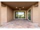 Covered patio with sliding glass doors leading inside at 35350 W Marin Ave, Maricopa, AZ 85138