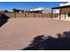 Large gravel backyard with block wall and partial view of home at 355 E 13Th Ave, Apache Junction, AZ 85119