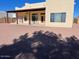 Home exterior view with covered patio and gravel backyard at 355 E 13Th Ave, Apache Junction, AZ 85119