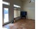 Living room with tile floor, large window, and sliding glass door at 355 E 13Th Ave, Apache Junction, AZ 85119