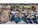 Aerial view of two homes in a golf course community at 3677 N Hudson Dr, Florence, AZ 85132