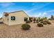 Landscaped backyard with gravel and desert plants at 3677 N Hudson Dr, Florence, AZ 85132