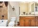 Bathroom with granite countertop, wood cabinets, and a tiled shower/tub combo at 3677 N Hudson Dr, Florence, AZ 85132