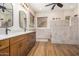 Elegant bathroom with double vanity, walk-in shower, and tile floors at 3677 N Hudson Dr, Florence, AZ 85132