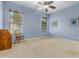 Light and airy bedroom with neutral walls and a ceiling fan at 3677 N Hudson Dr, Florence, AZ 85132