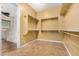 Large walk-in closet with ample shelving and hanging space at 3677 N Hudson Dr, Florence, AZ 85132