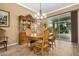 Elegant dining room with hardwood floors, a china cabinet, and patio access at 3677 N Hudson Dr, Florence, AZ 85132