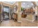 Home entry showing kitchen and a console table with flowers at 3677 N Hudson Dr, Florence, AZ 85132