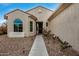 House entrance with walkway, landscaping, and decorative lighting at 3677 N Hudson Dr, Florence, AZ 85132