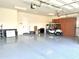 Bright and spacious garage with storage cabinets and golf cart at 3677 N Hudson Dr, Florence, AZ 85132