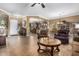 Spacious living room with hardwood floors and a view into the kitchen at 3677 N Hudson Dr, Florence, AZ 85132