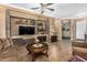 Living area featuring a stone wall and built-in shelving at 3677 N Hudson Dr, Florence, AZ 85132