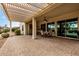 Spacious covered patio with pergola and outdoor seating area at 3677 N Hudson Dr, Florence, AZ 85132