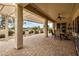 Covered patio with brick pavers, pergola, and outdoor furniture at 3677 N Hudson Dr, Florence, AZ 85132