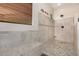 Walk-in shower with pebble floor and built-in seat at 3677 N Hudson Dr, Florence, AZ 85132