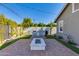 Outdoor kitchen with grill, pizza oven and fire pit at 3838 E Devonshire Ave, Phoenix, AZ 85018