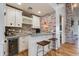 Modern bar with granite countertop, wine cooler, and custom cabinetry at 3838 E Devonshire Ave, Phoenix, AZ 85018